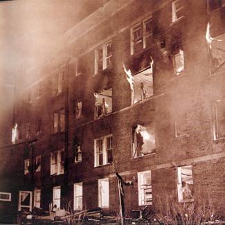 Women's Residence Hall on fire after explosion, which caused the death of Roberta Steel.  April 28, 1951.